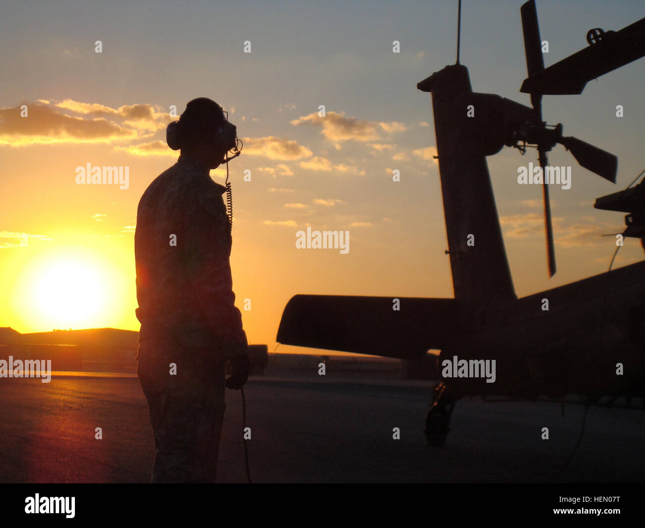 An AH64 Apache Longbow crew chief prepares a 1st Attack Stock Photo