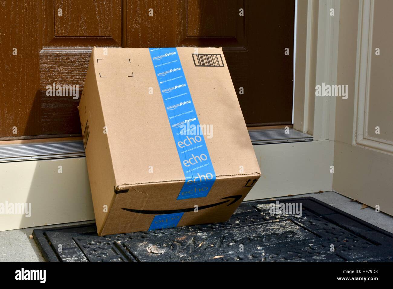 An Amazon Prime package delivered to the front door of a home Stock