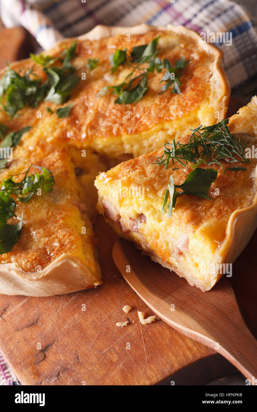 A Piece Of French Quiche Lorraine Close Up On A Cutting Board Vertical