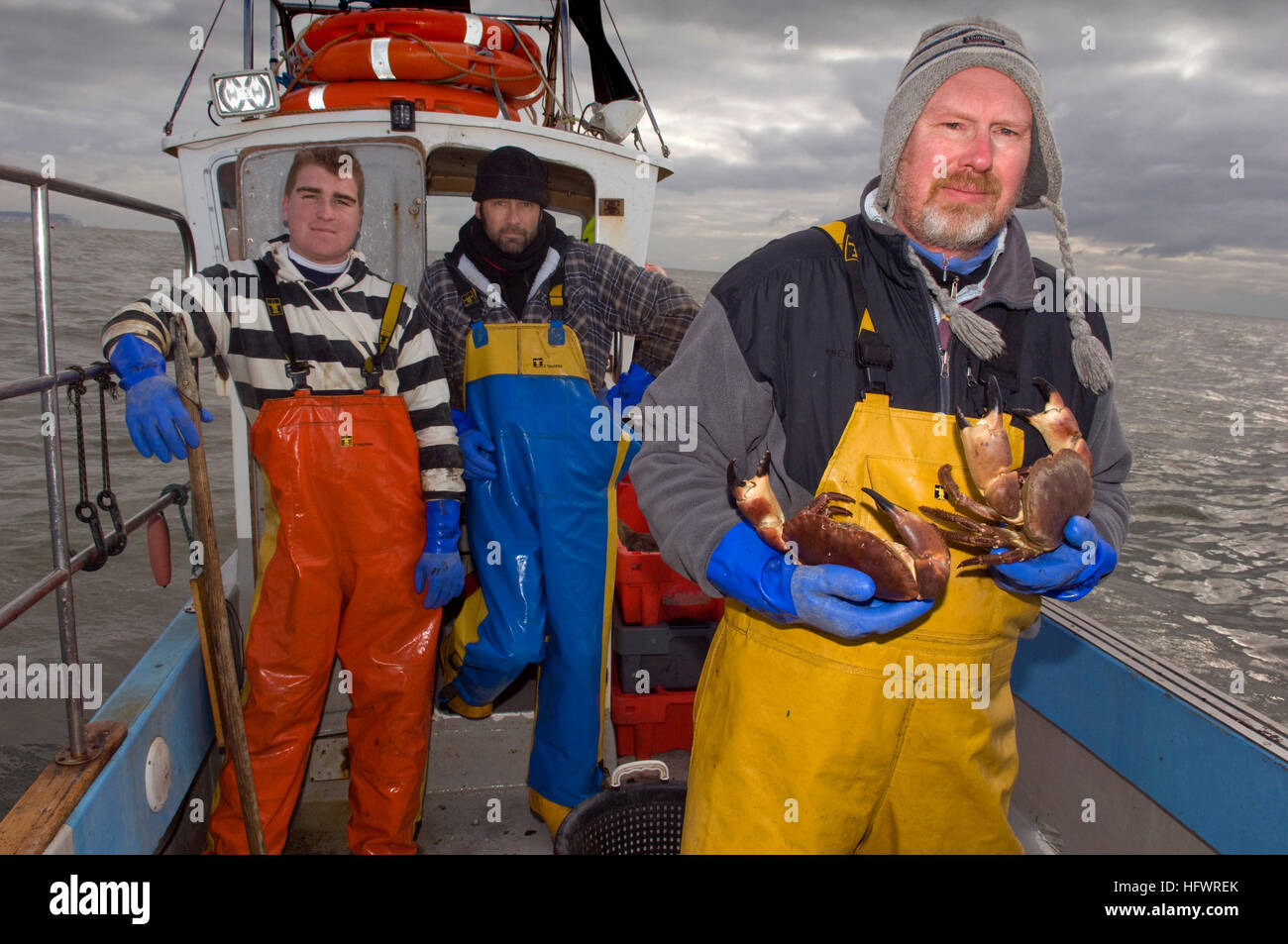 Crab fishing in Dorset with Les Lawrence (yellow wader) with fellow
