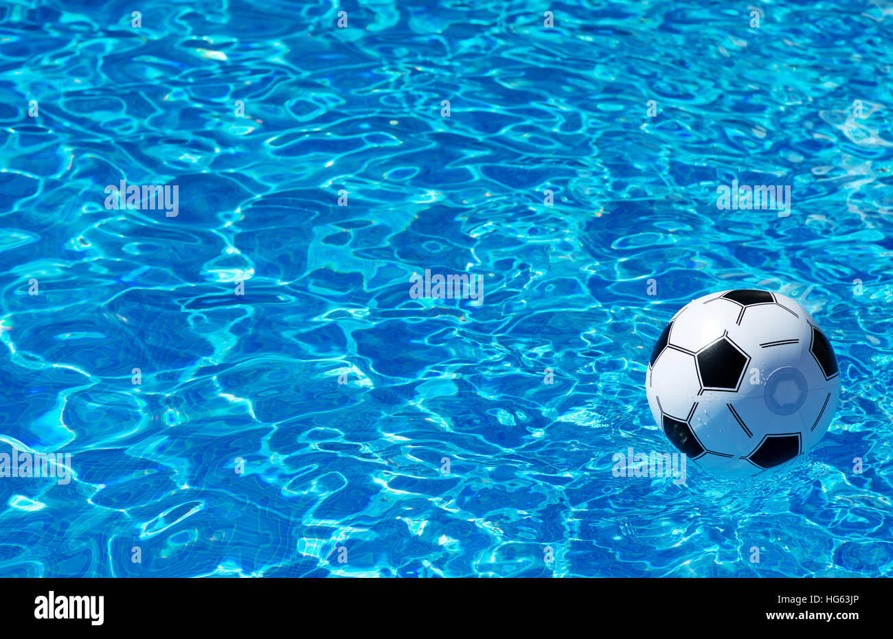 Pool Water With Beach Ball beach ball floating in blue swimming pool. space for text stock Pool Water With Beach Ball beach ball floating in blue swimming pool. space for text stock