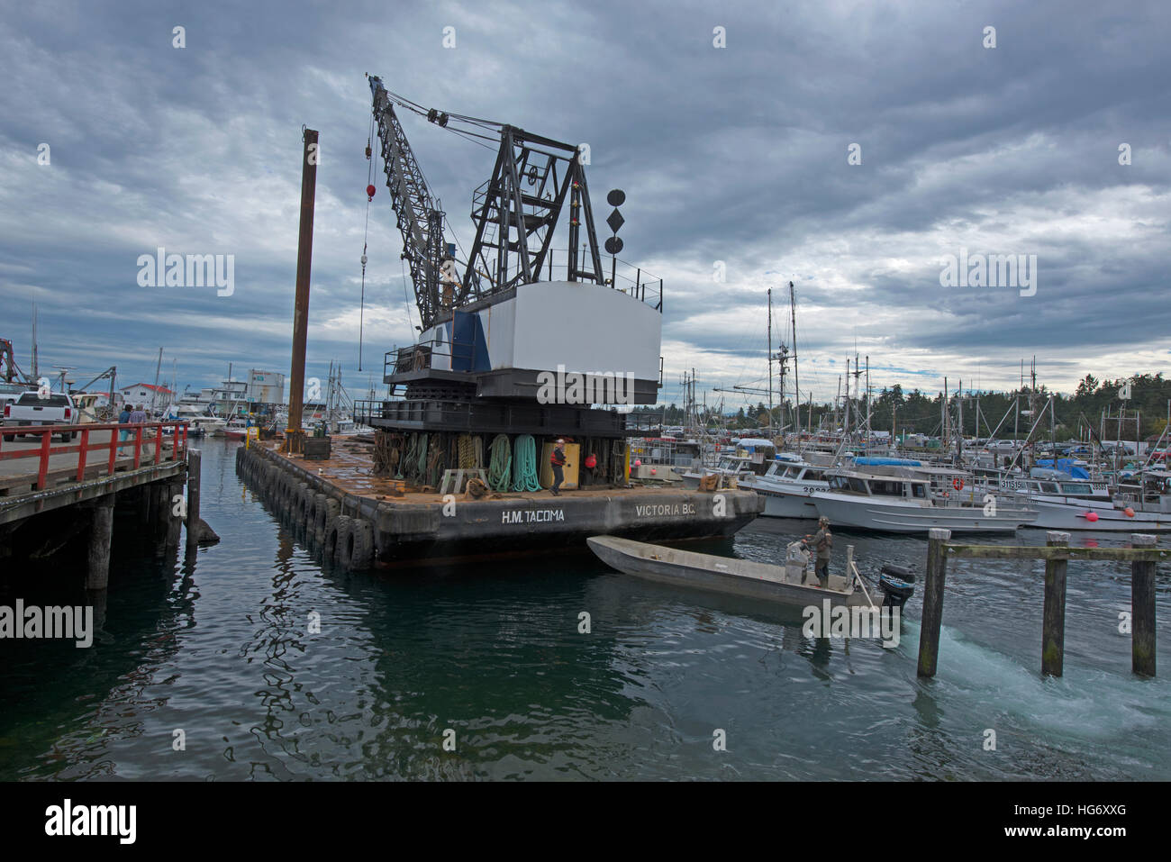 Pile driving crane HM floating debris barge working in French Stock Photo, Royalty Free
