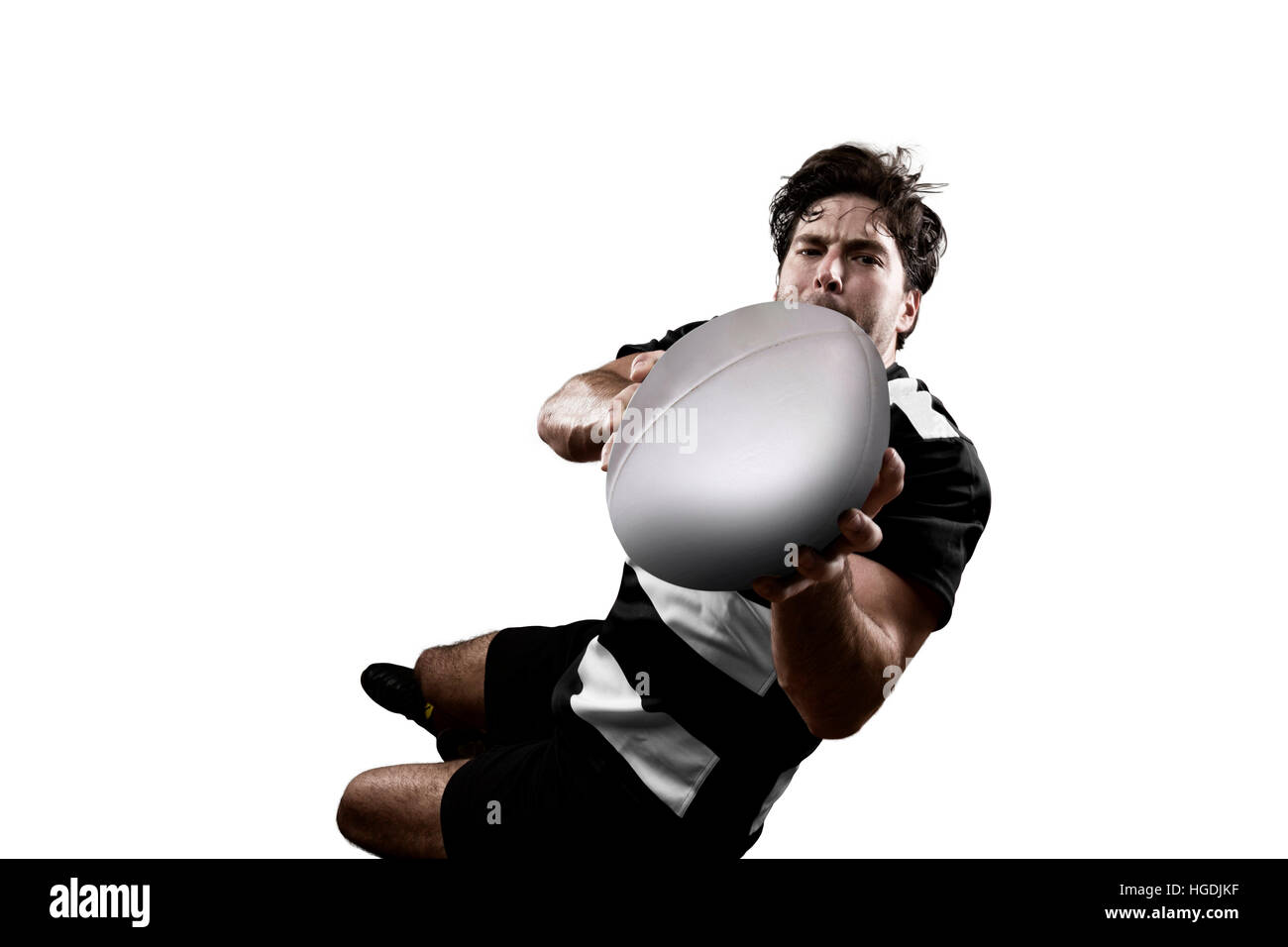 Rugby Player In A Black And White Uniform White Background Stock Photo