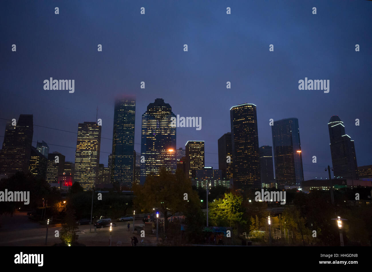 Downtown Houston skyline at night with dark blue stormy sky. Buffalo