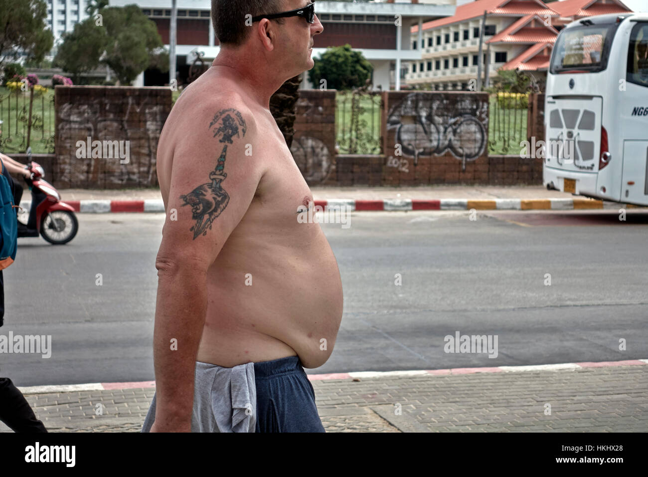 obese-shirtless-male-with-overhanging-pronounced-stomach-HKHX28.jpg