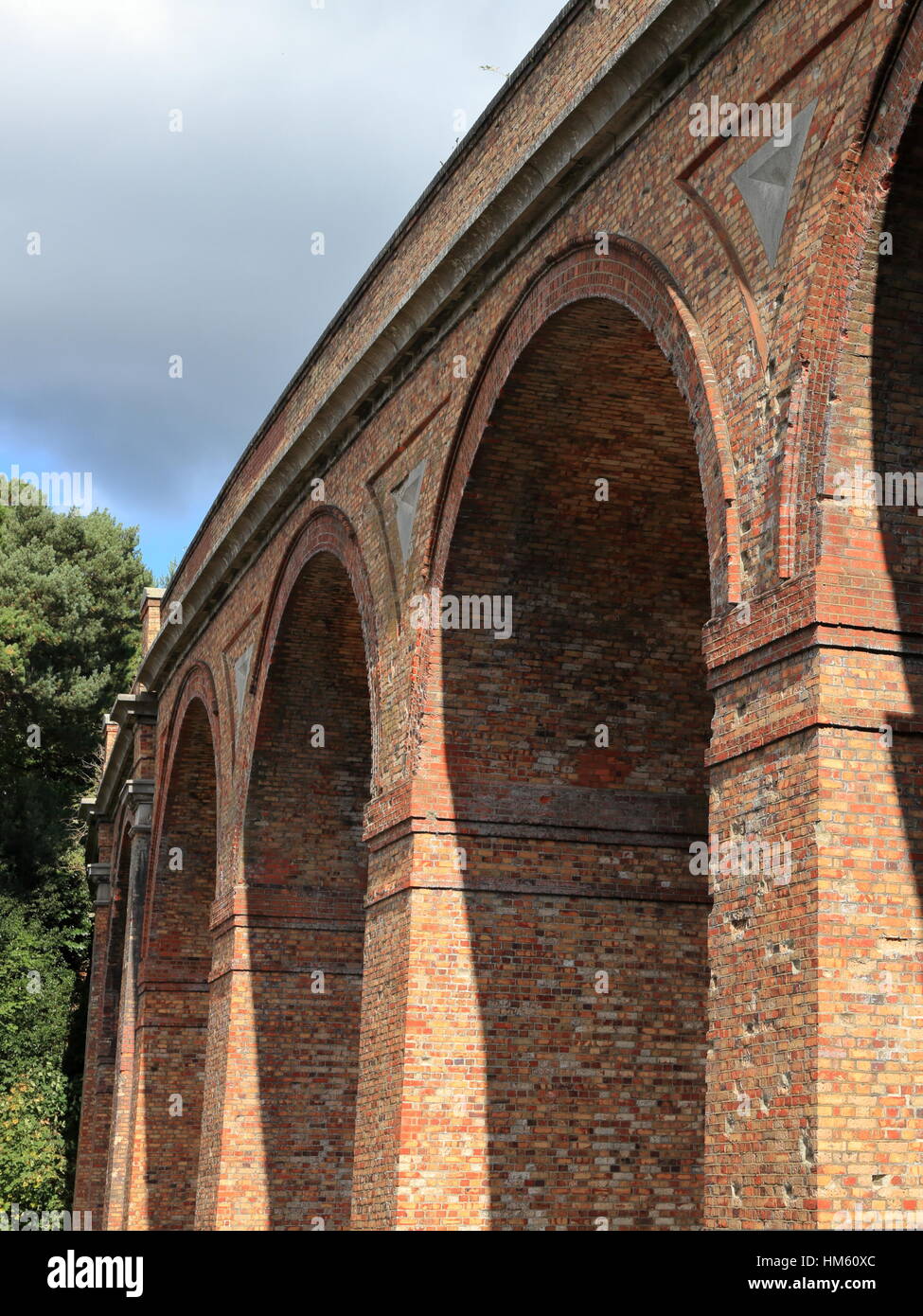 Victorian brick built railway viaduct archways across the Bourne Stock