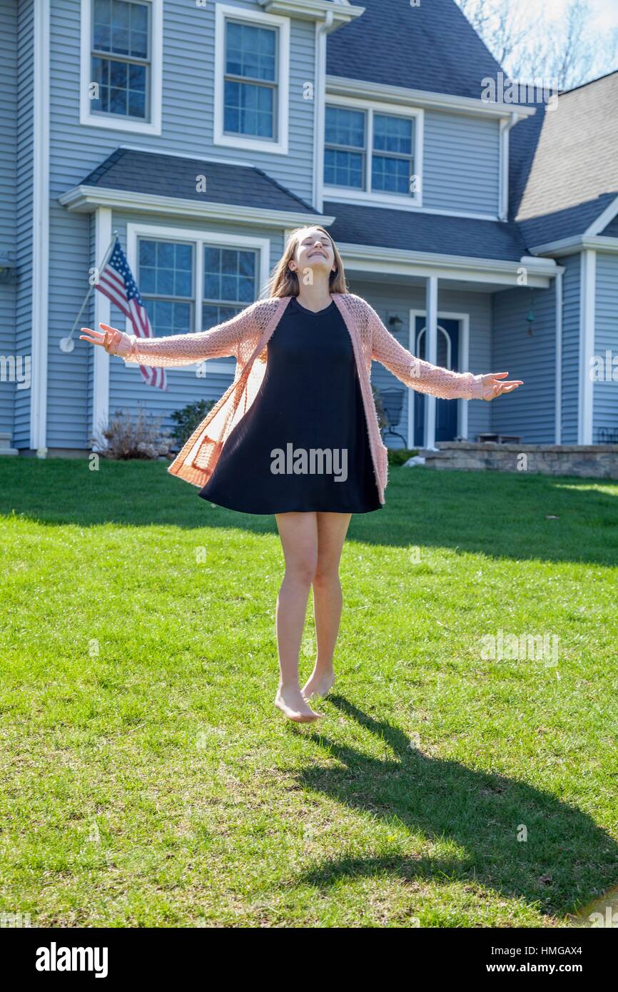 Teenage Girl Standing In Front Of Her House Stock Photo Alamy