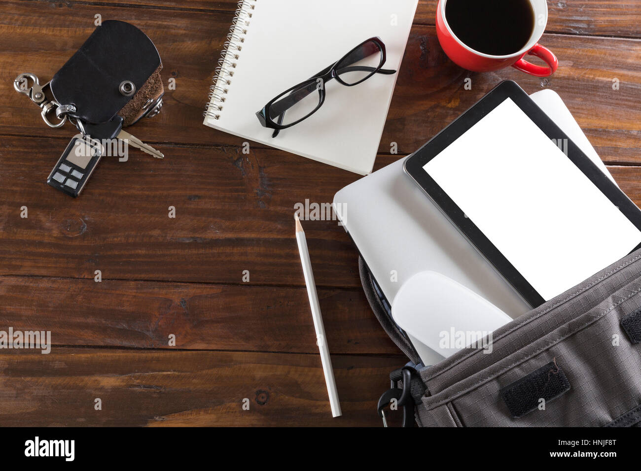 car key, laptop computer and tablet on wooden office desk - top car key, laptop computer and tablet on wooden office desk - top