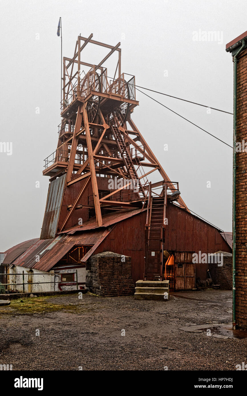 Big Pit Welsh coal mine winding tower under grey sky Stock Photo