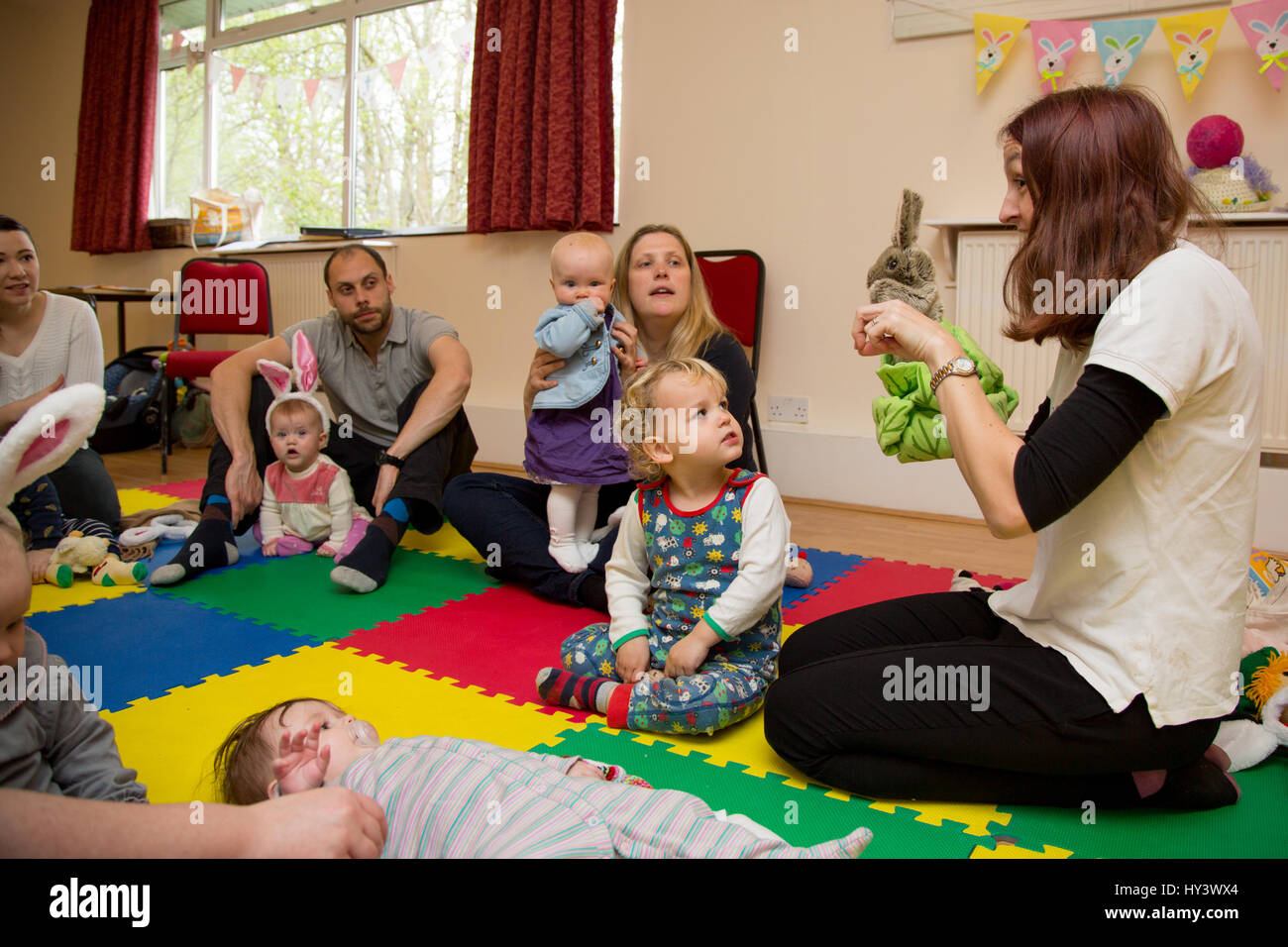 Parents and children learning baby sign language Stock Photo, Royalty