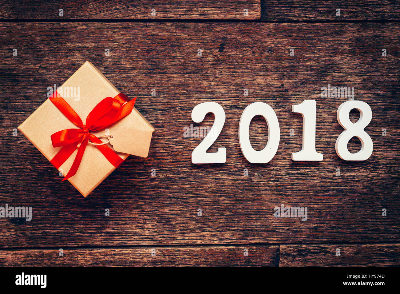 Wooden Numbers Forming The Number 2018 For New Year On Rustic With Gift Box And Red Ribbon Wooden Numbers Forming The Number 2018 For New Year On Rustic With Gift Box And Red Ribbon