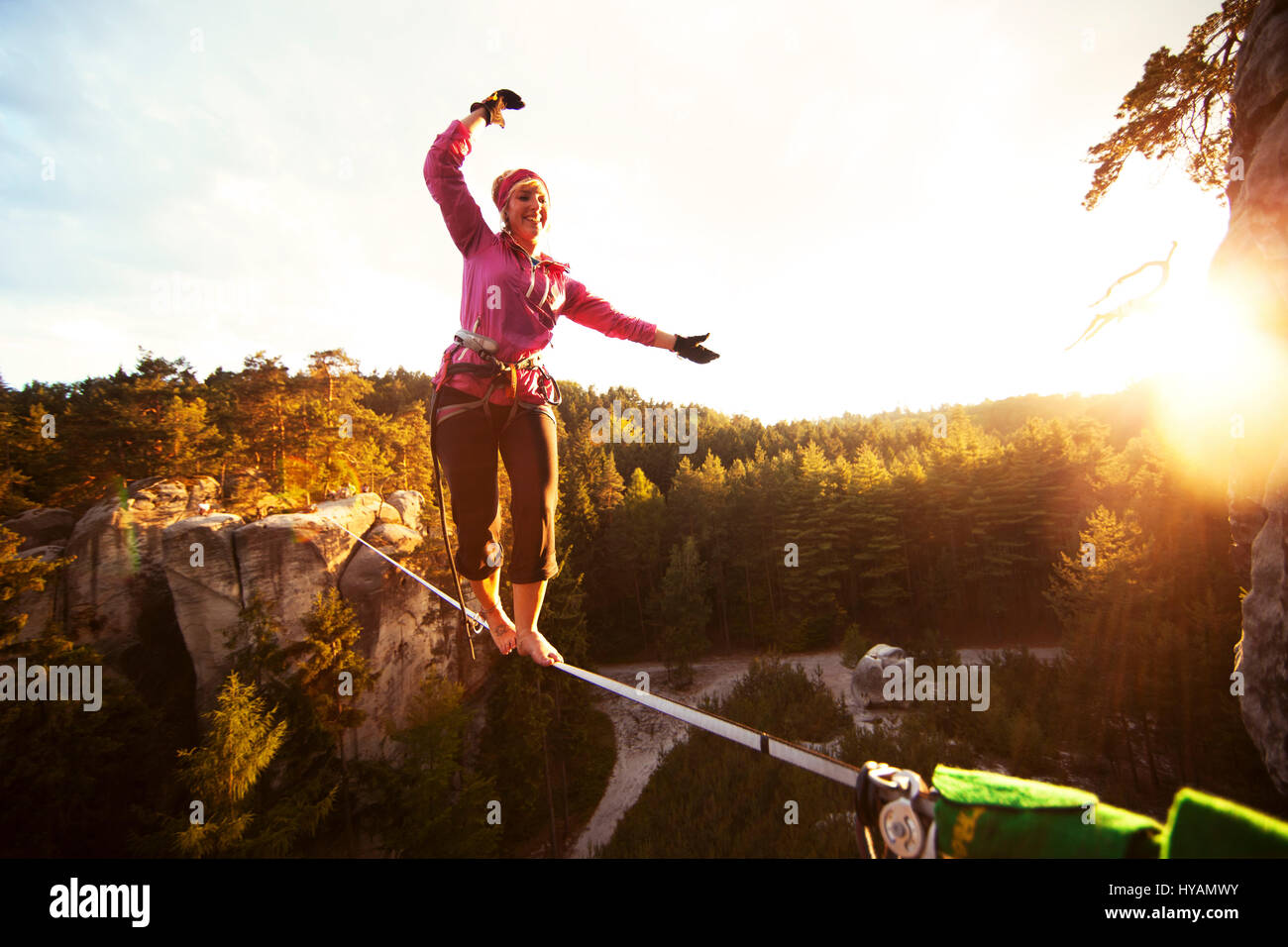 OSTROV, CZECH REPUBLIC A female slackliner shows off on the Stock