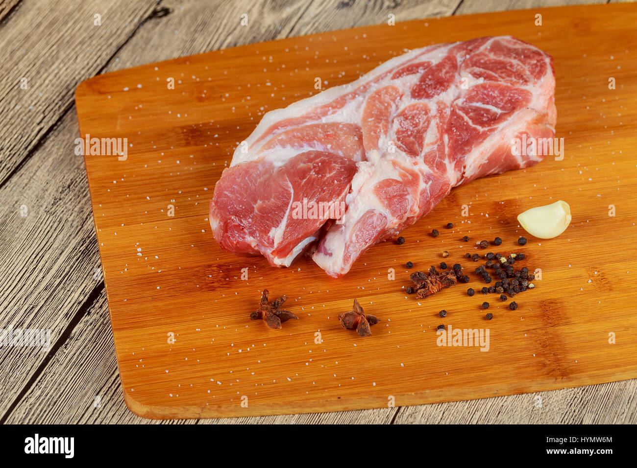 Raw Pork Meat On A Wooden Board Raw Pork Chop And Steaks For Barbecue