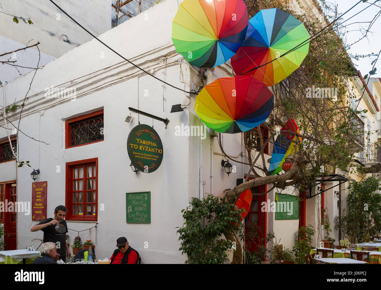 nafplion, greece - 24 march, 2017: people sitting outside a stock nafplion, greece - 24 march, 2017: people sitting outside a stock