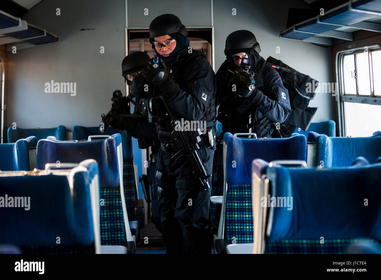 British armed police officers firearms exercise where they storm a