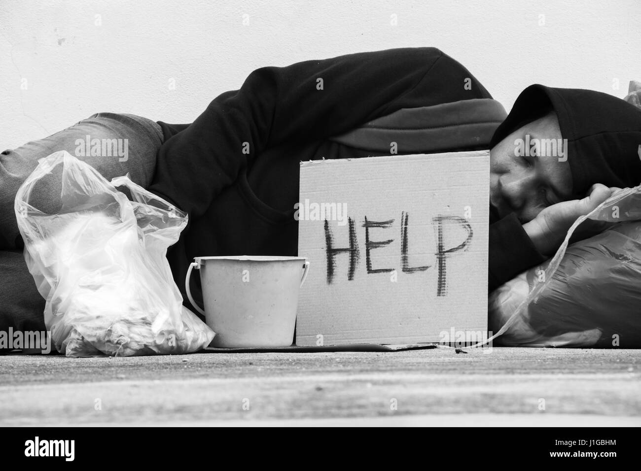 Homeless Person Sleep On Sidewalk Of The Street Stock Photo Alamy