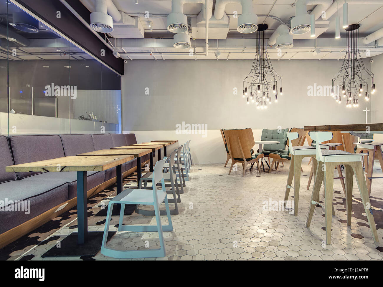 Loft Style hall in a loft style in a cafe with light walls and black and Loft Style hall in a loft style in a cafe with light walls and black and