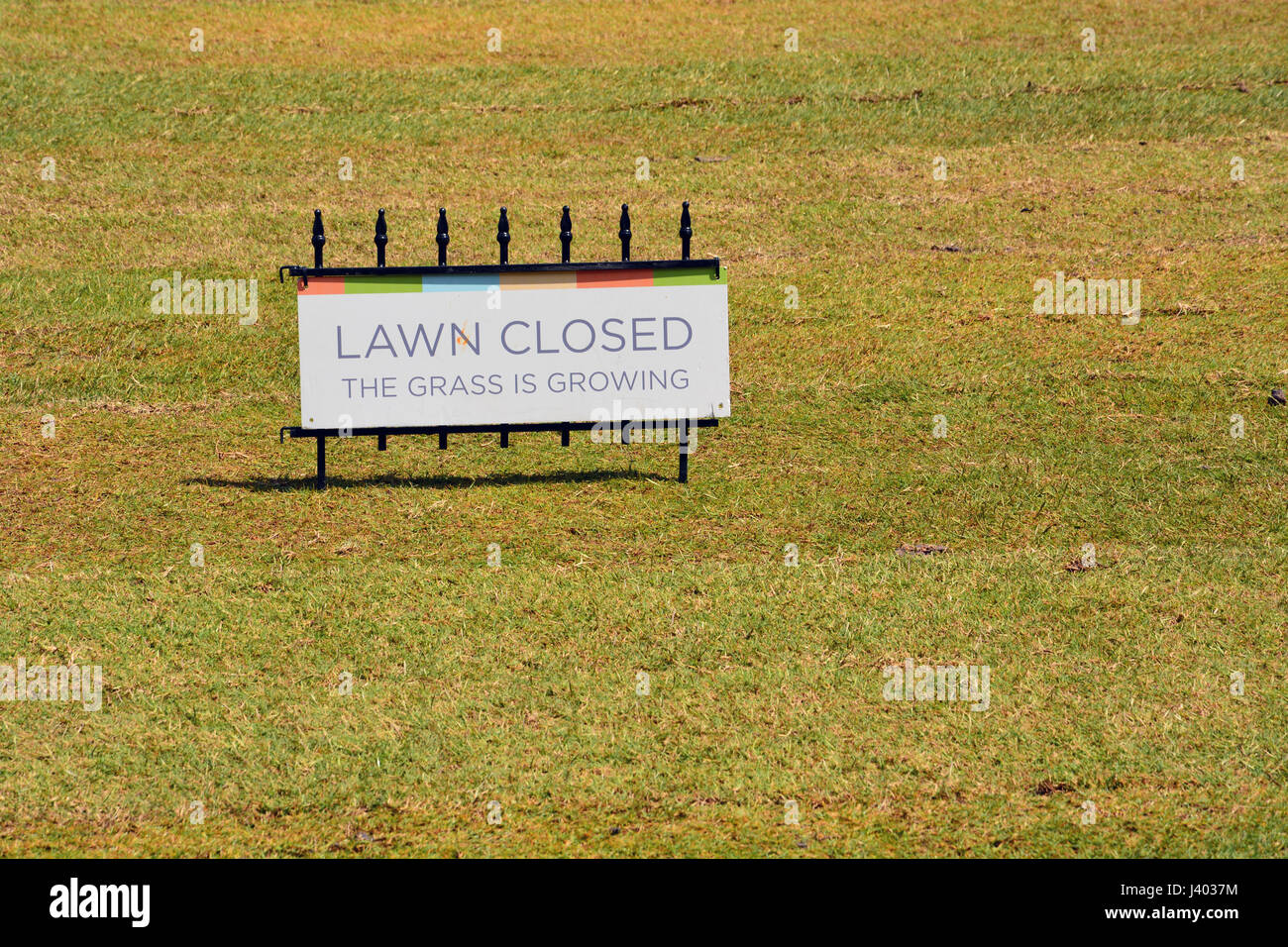 signs-are-posted-to-stay-off-the-new-grass-on-the-large-central-lawn-J4037M.jpg