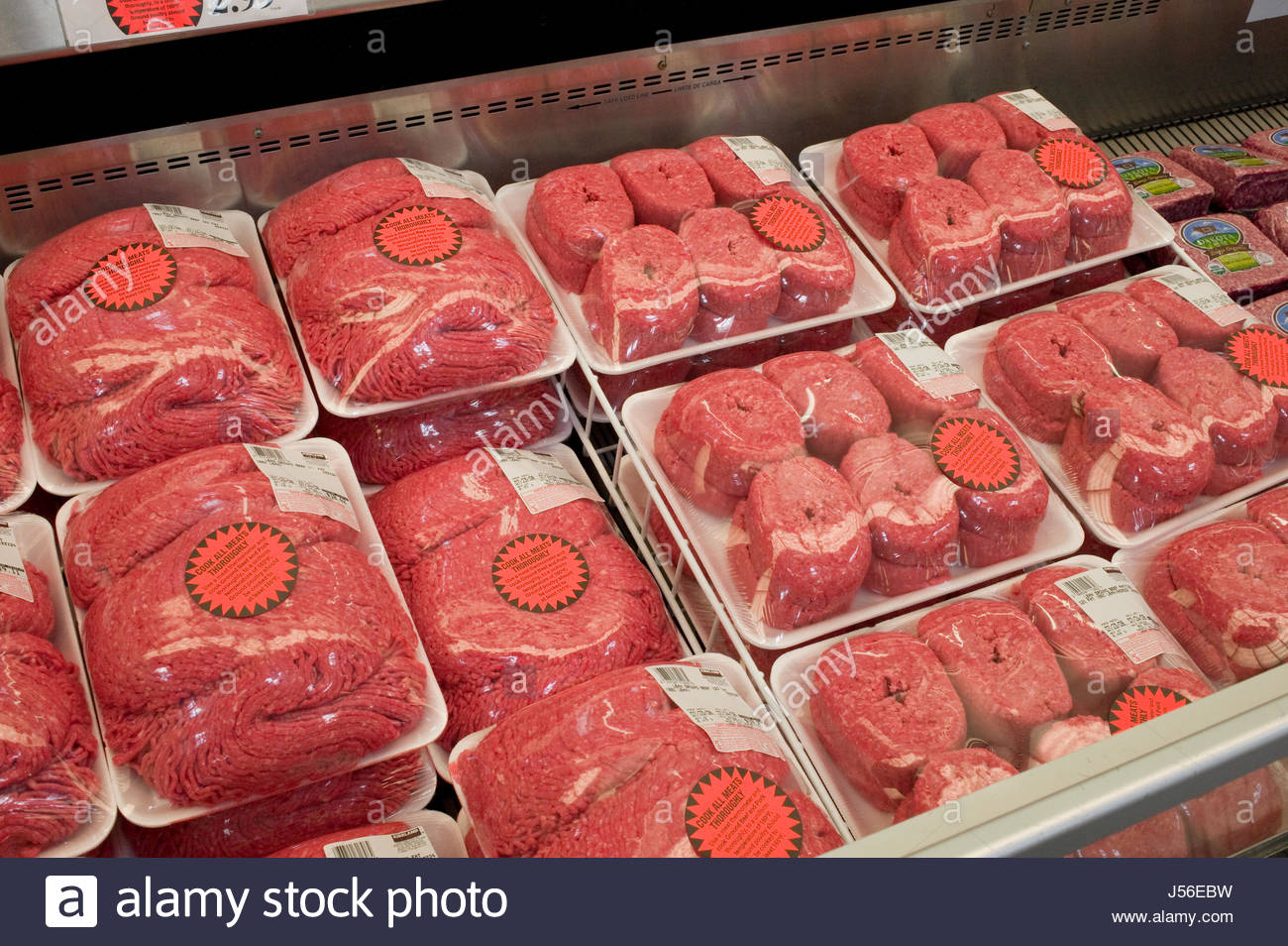 Fresh ground beef wrapped in plastic on display at Costco Warehouse