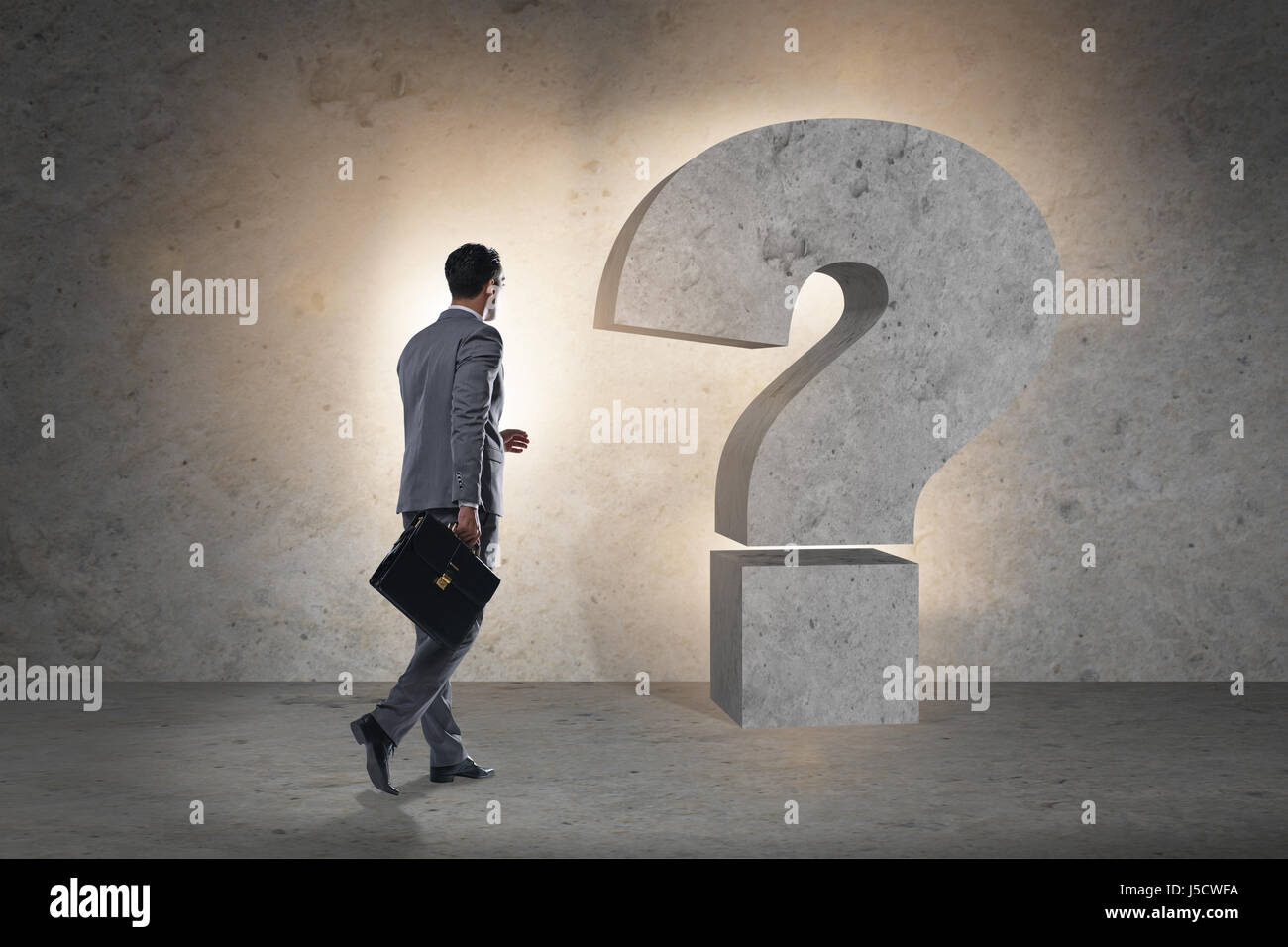 Businessman facing questions in business Stock Photo, Royalty Free