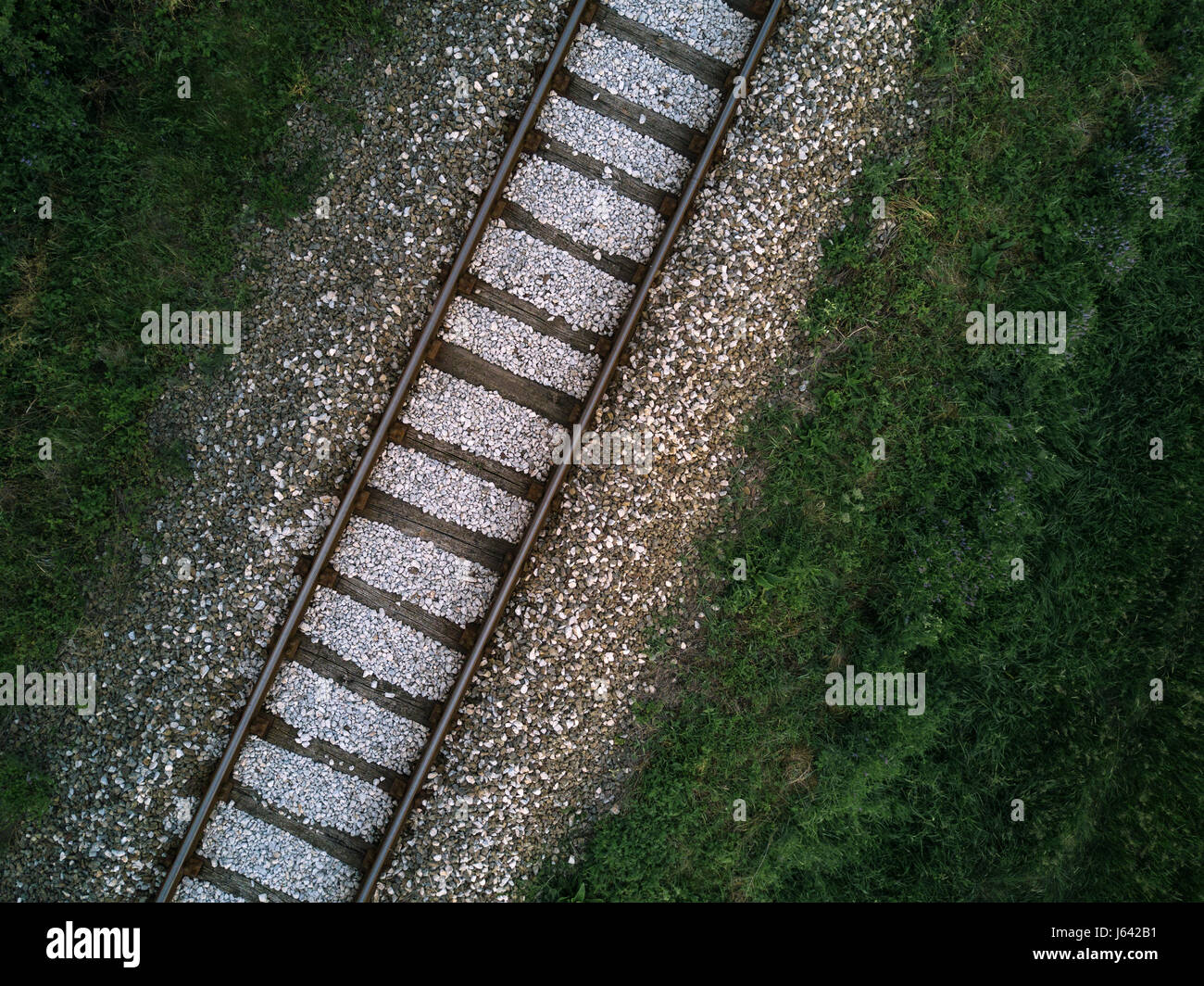 Aerial view of railway track through countryside, drone top view pov