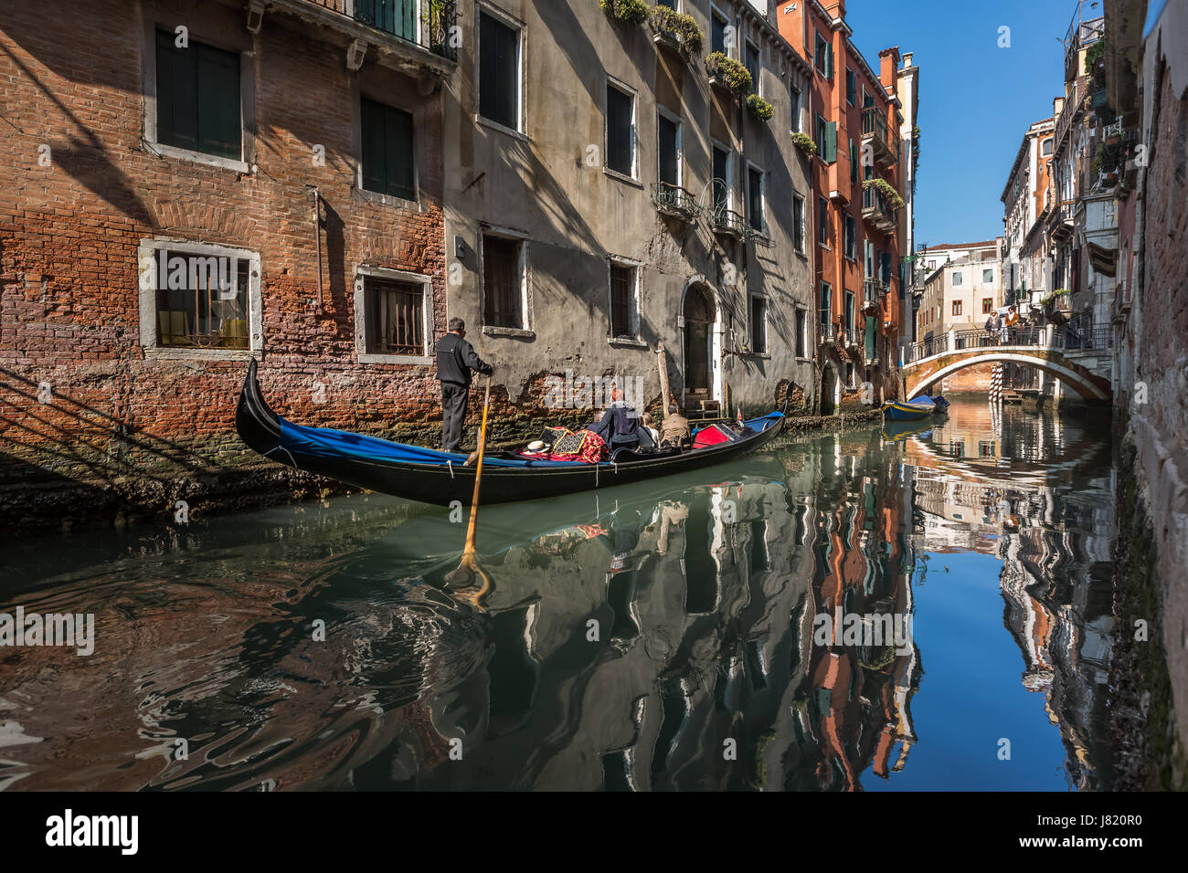 Traditional Venice Gondola Ride Along Narrow Canal Venice Italy Stock