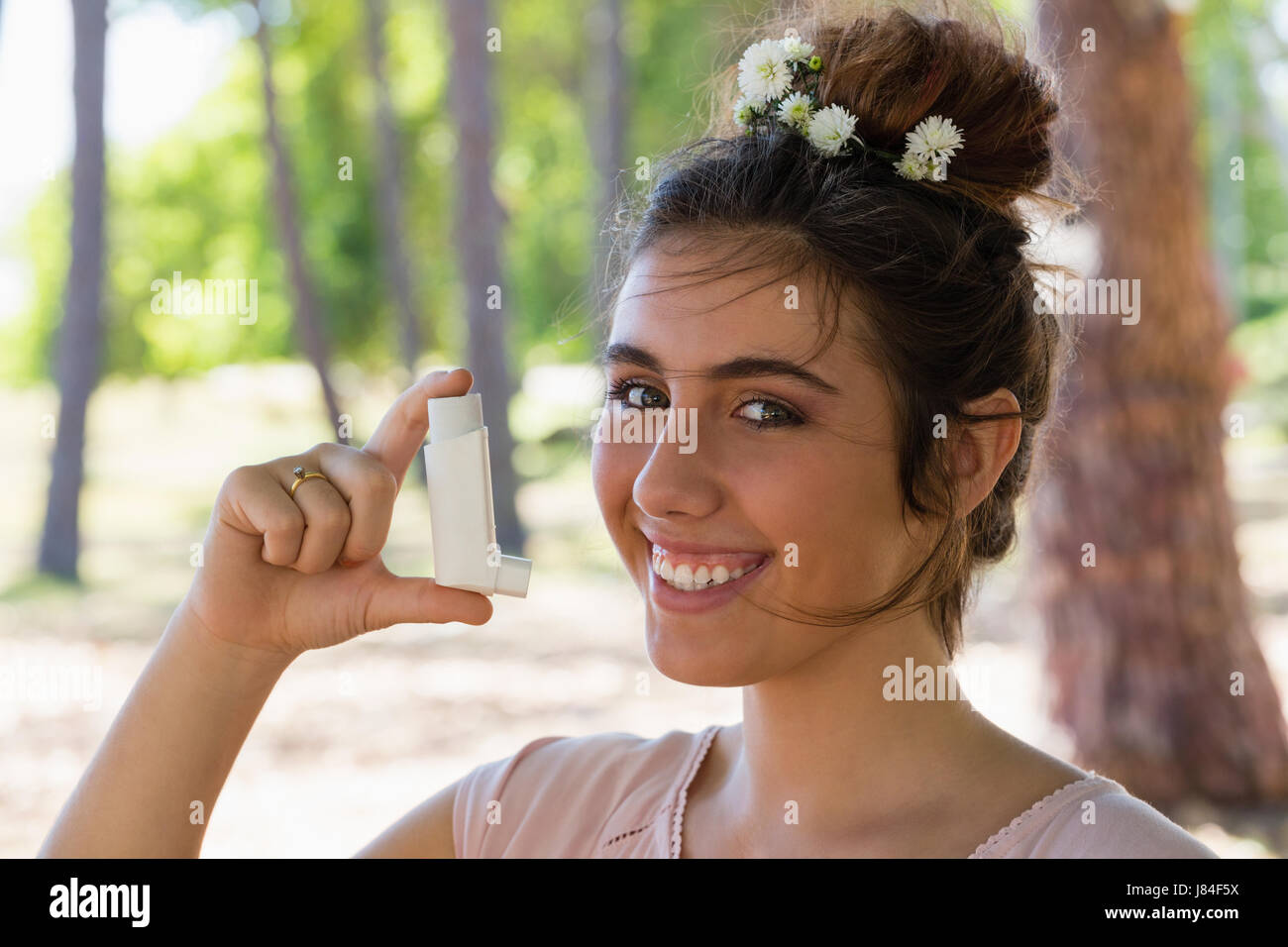 Portrait Of Woman Using Asthma Inhaler In The Park Stock Photo Alamy