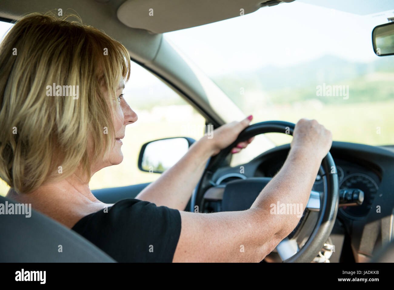 Lifestyle Photo Of Attractive Mature Woman Driving Car Stock Photo Alamy