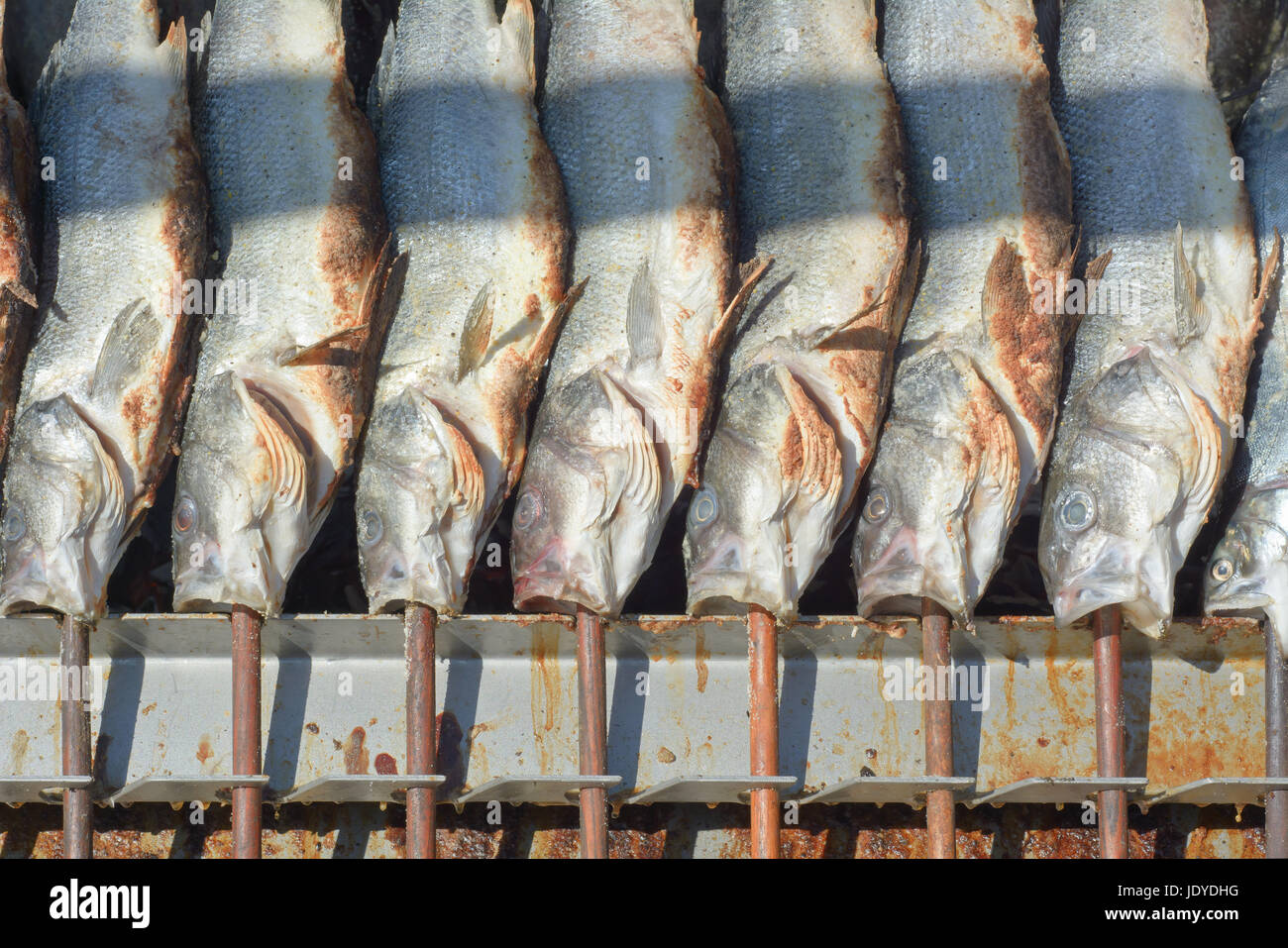 Grilled fish on a Stick at the Munich Oktoberfest Stock Photo, Royalty