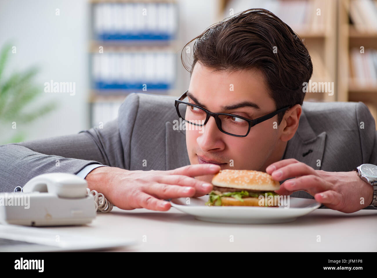 Hungry Funny Businessman Eating Junk Food Sandwich Stock Photo Alamy