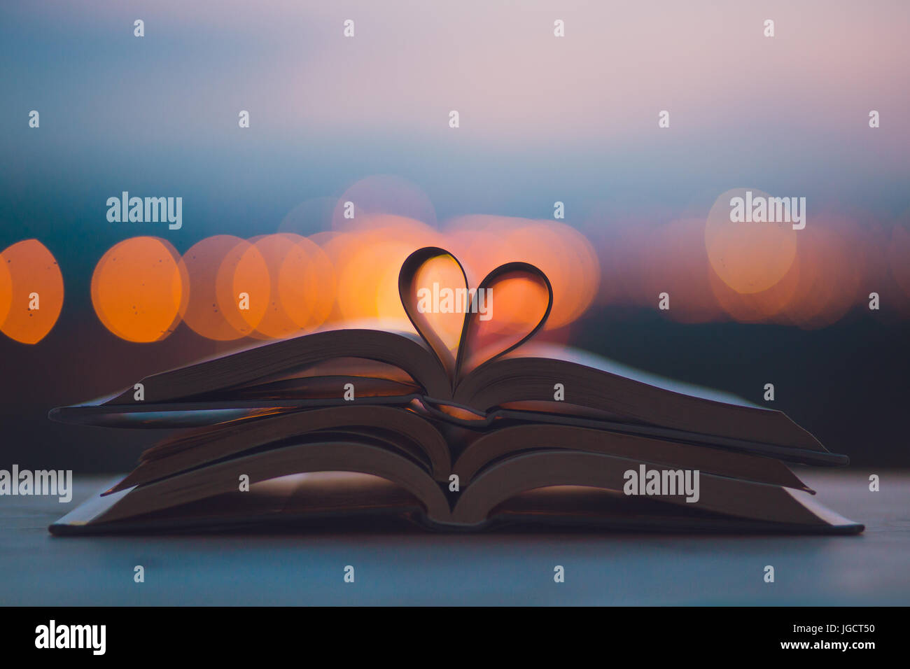 Open Book With Pages In A Heart Shape Stock Photo Alamy