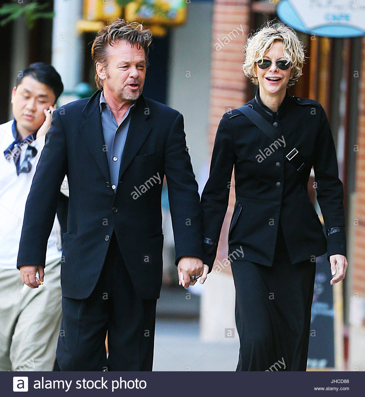 John Mellencamp and. Meg Ryan and John Mellencamp take a romantic Stock