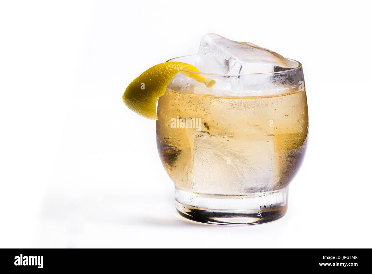 refreshing scotch and soda served on the rocks with a lemon twist