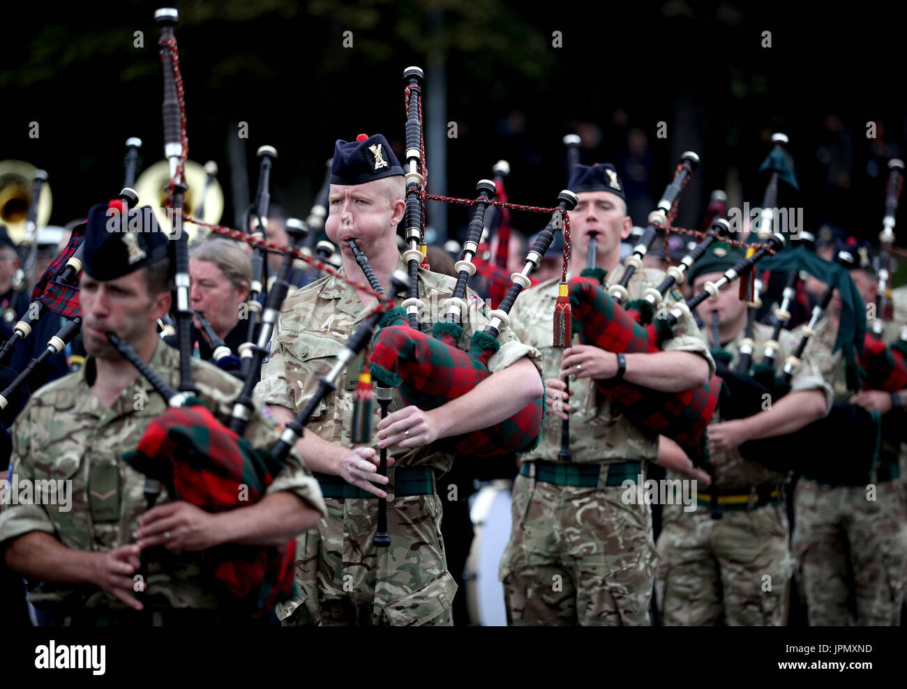 Members of the Royal Regiment of Scotland (2 SCOTS) massed pipes and