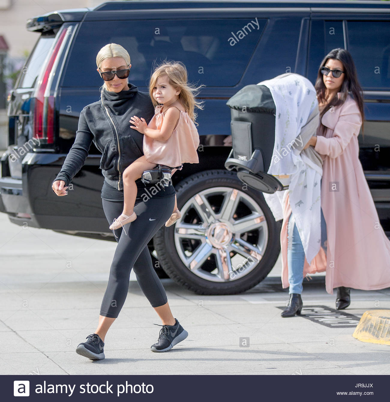 Kim Kardashian, Penelope Disick, Kourtney Kardashian and Reign Stock