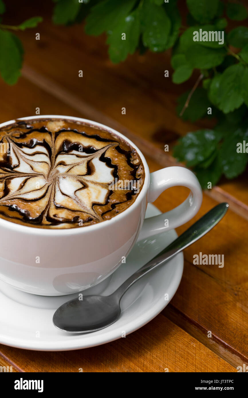 Coffee Cup Of Cappuccino Hot With Zigzag Caramel On Wooden Background Close Up Coffee Cup Of Cappuccino Hot With Zigzag Caramel On Wooden Background Close Up