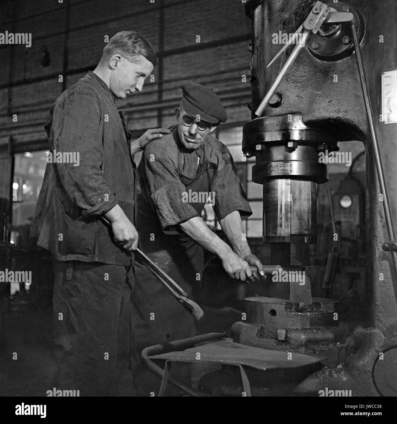 Blacksmiths working with steam hammer in factory Stock Photo, Royalty Free Image 153322268 Alamy