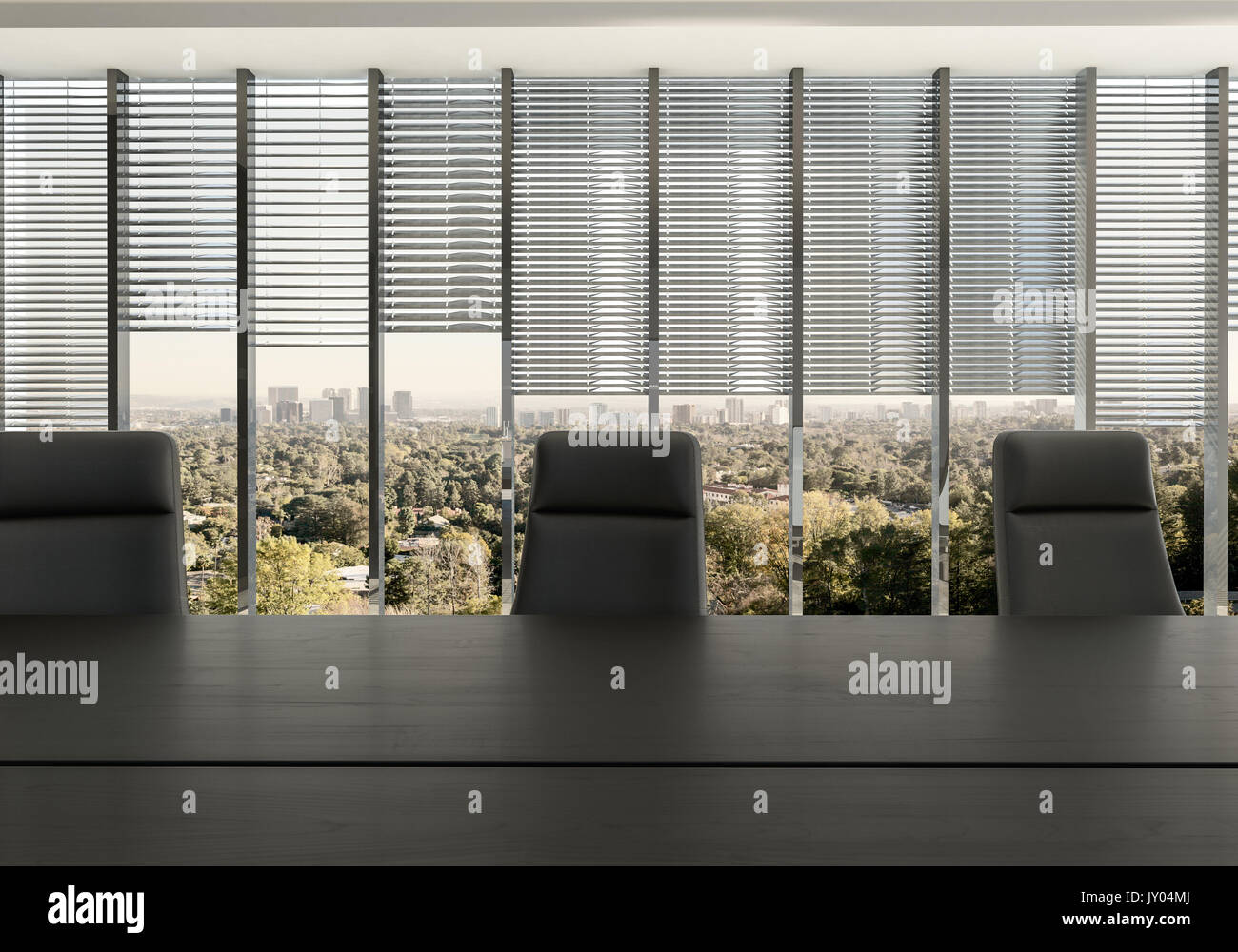 Empty chairs at desk in office room against partly covered windows ... Empty chairs at desk in office room against partly covered windows ...