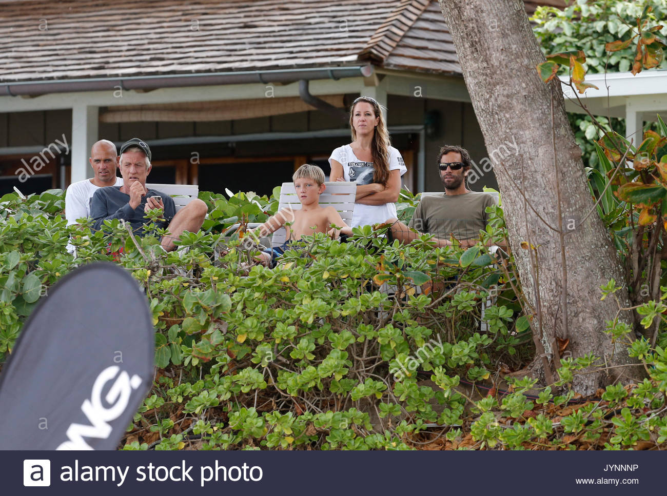 Jack Johnson and Kelly Slater. Singer Jack Johnson and family are Stock