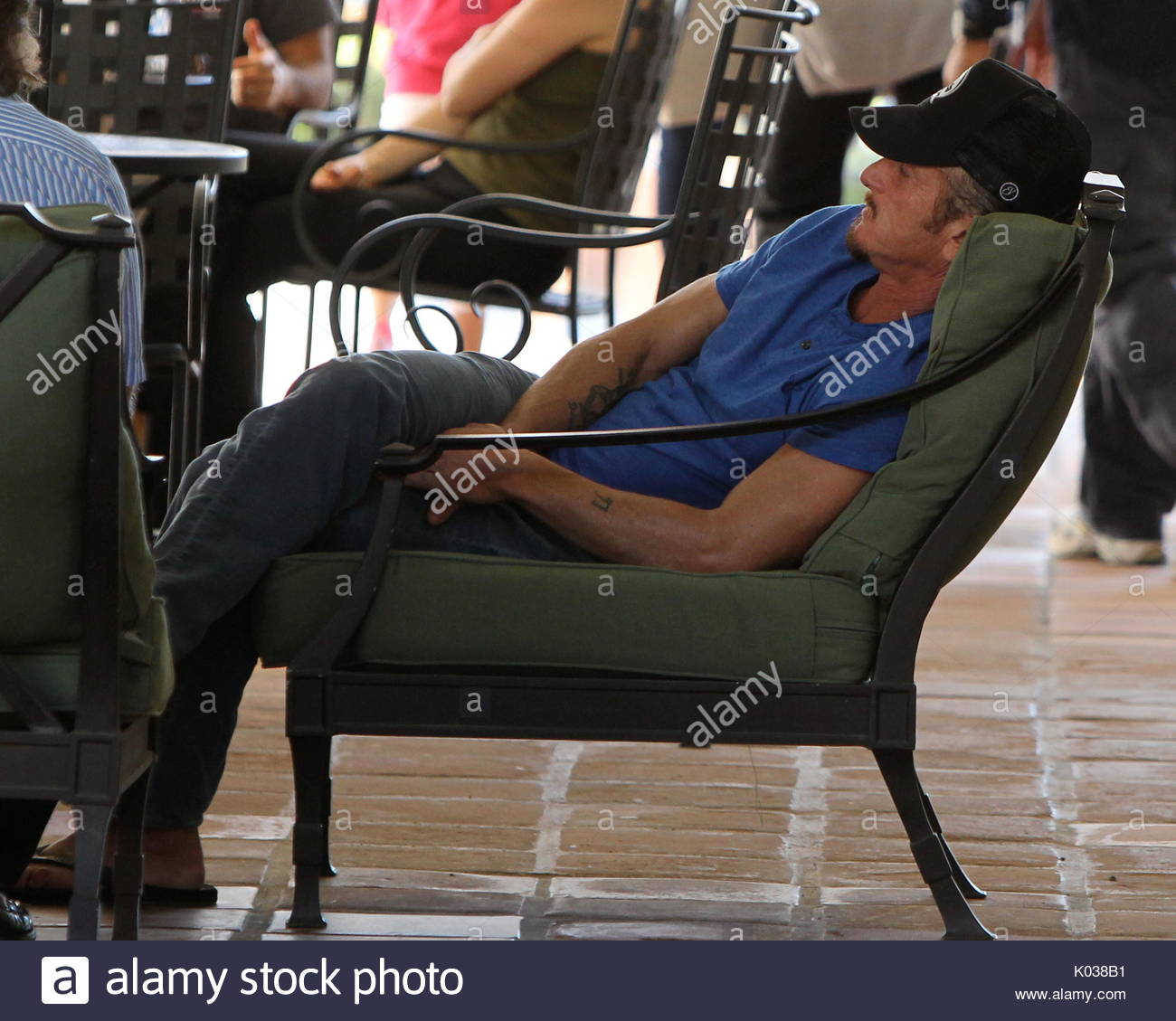 Sean Penn. Sean Penn wears two pairs of glasses at Cross Creek in Stock