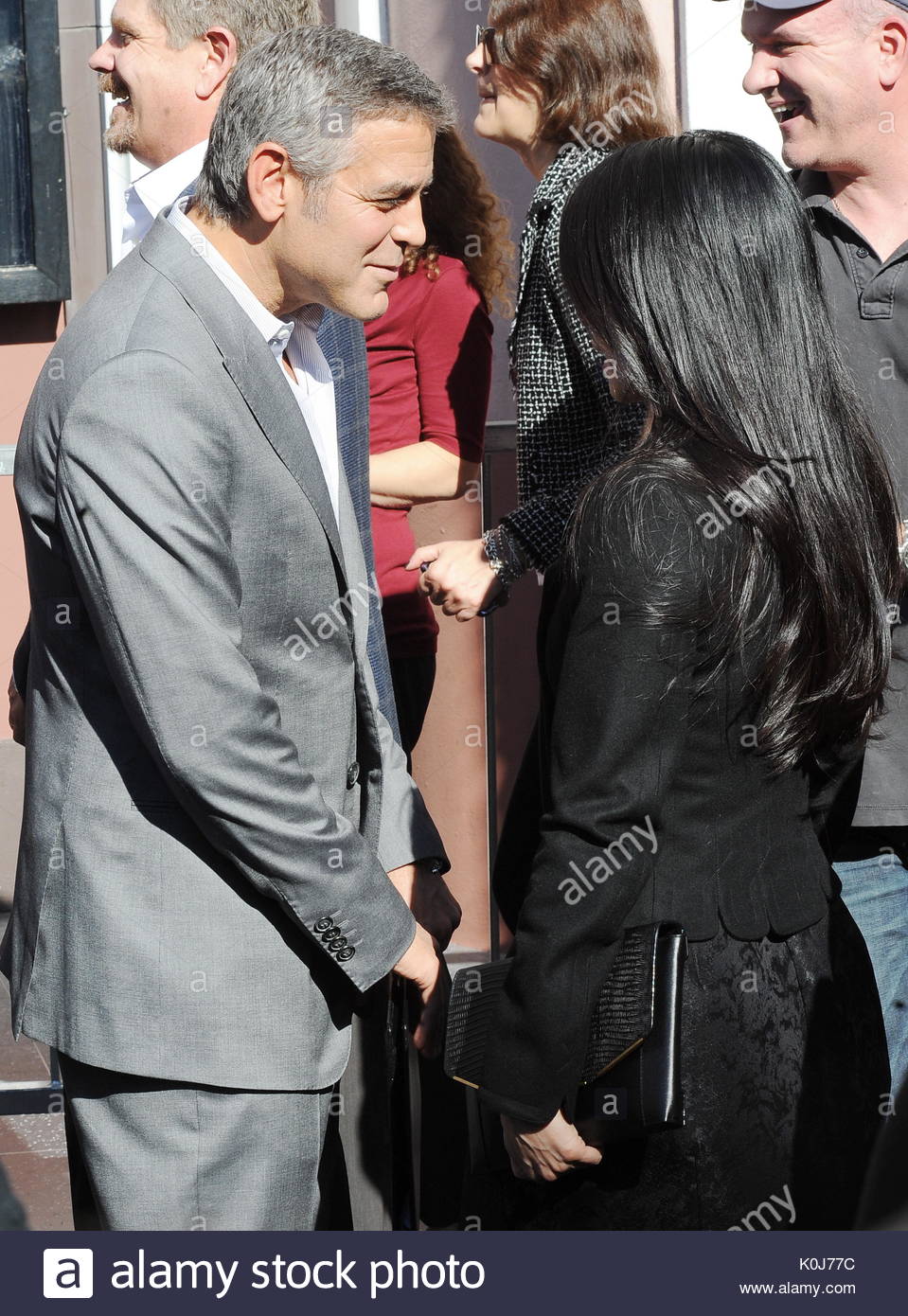 Clooney and Lucy Liu. Clooney turns on the star charm