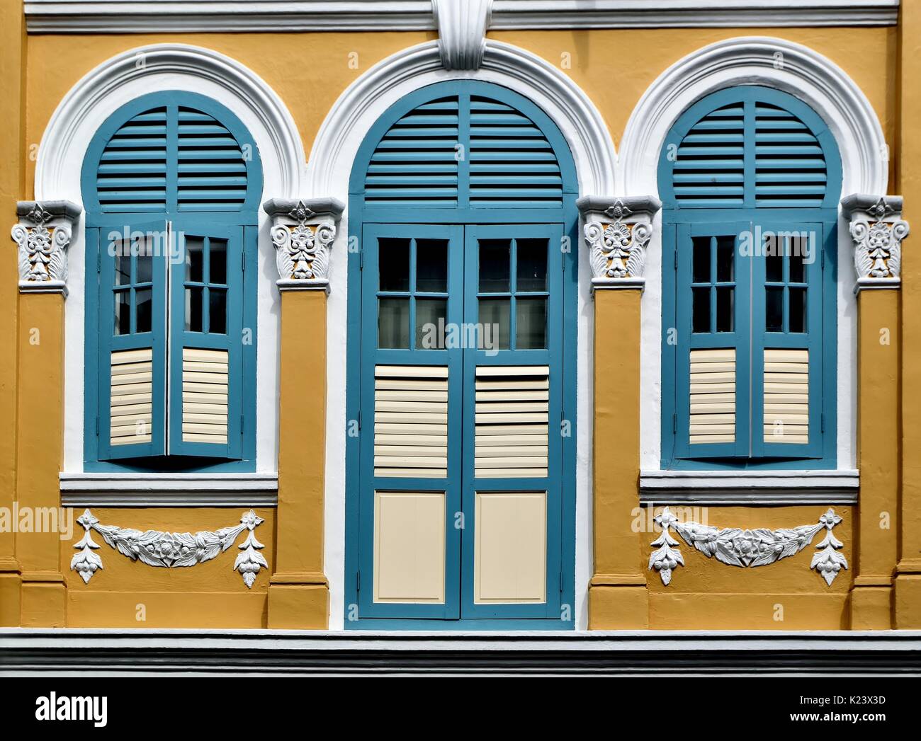 Traditional shop house exterior with blue wooden louvered shutters ... Traditional shop house exterior with blue wooden louvered shutters ...