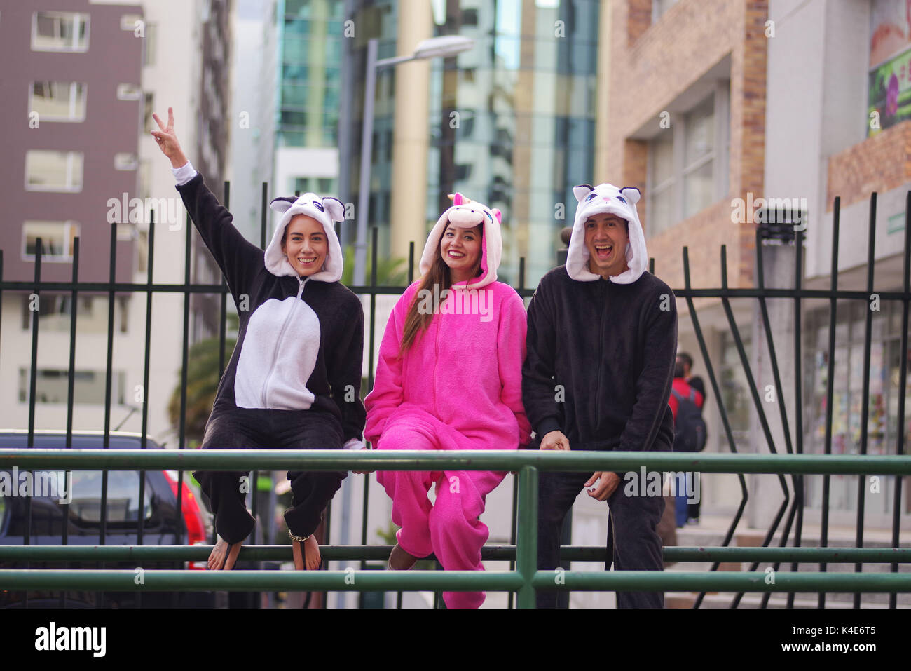 Close Up Of A Happy Group Friends Waiting The Public Transportation And Wearing Different Costumes One Woman Pink Unicorn Costume Close Up Of A Happy Group Friends Waiting The Public Transportation And Wearing Different Costumes One Woman Pink Unicorn Costume