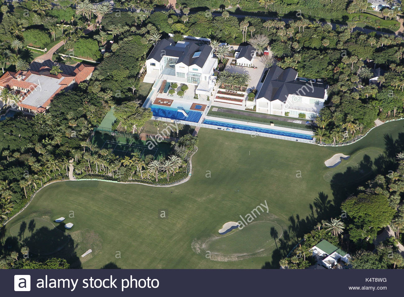 Tiger Wood's house in Jupiter Island, Florida. Workmen carry out the