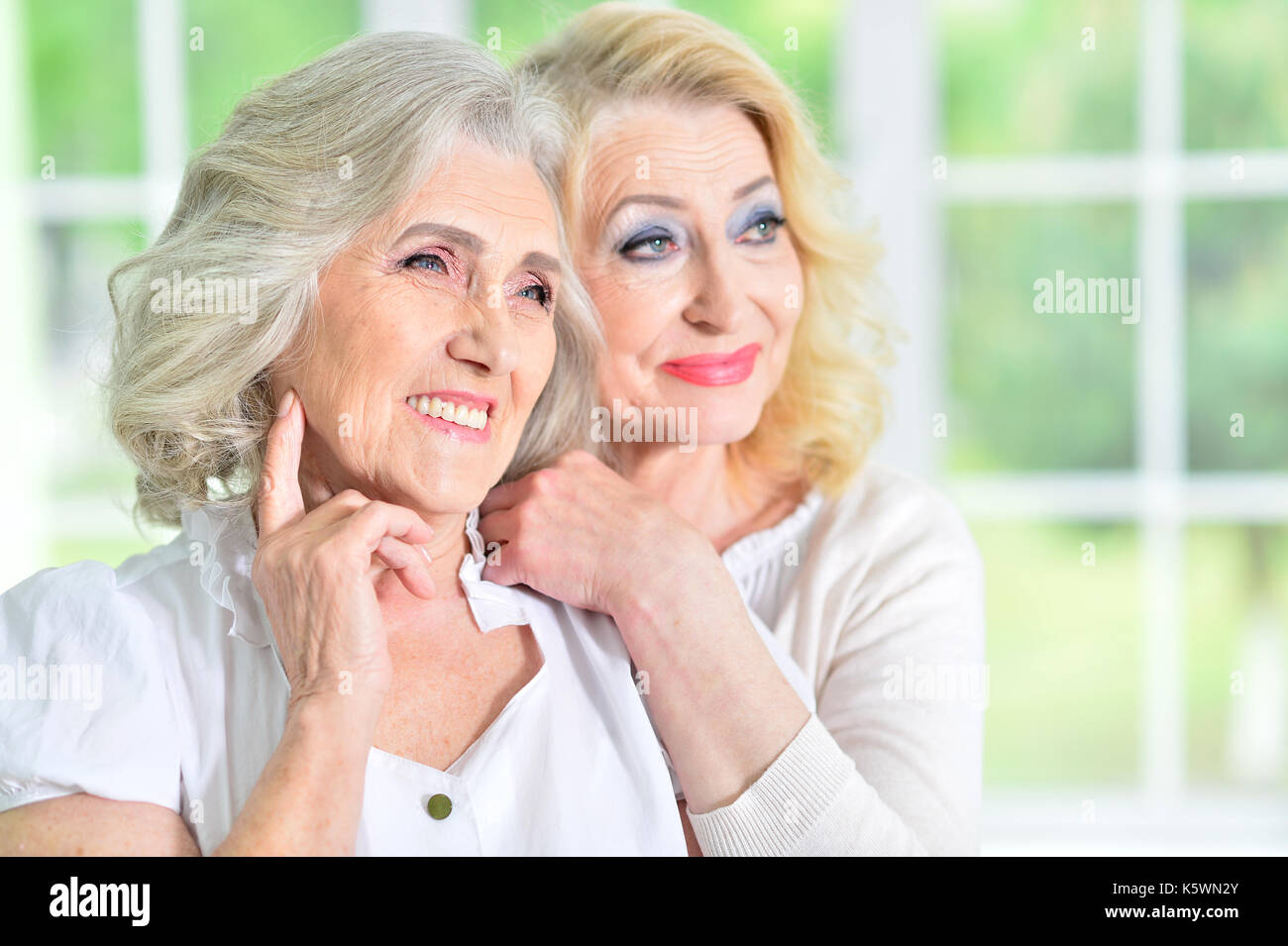 Mature Woman Hugging Mother Stock Photo Alamy