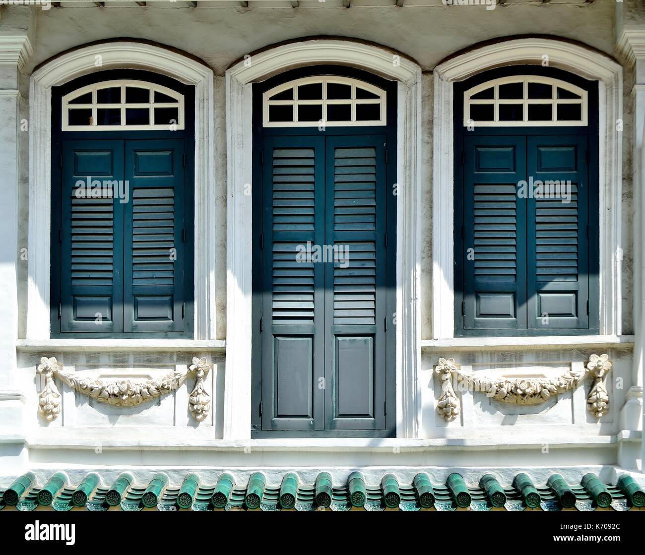 Traditional shop house exterior with blue wooden louvered shutters ... Traditional shop house exterior with blue wooden louvered shutters ...