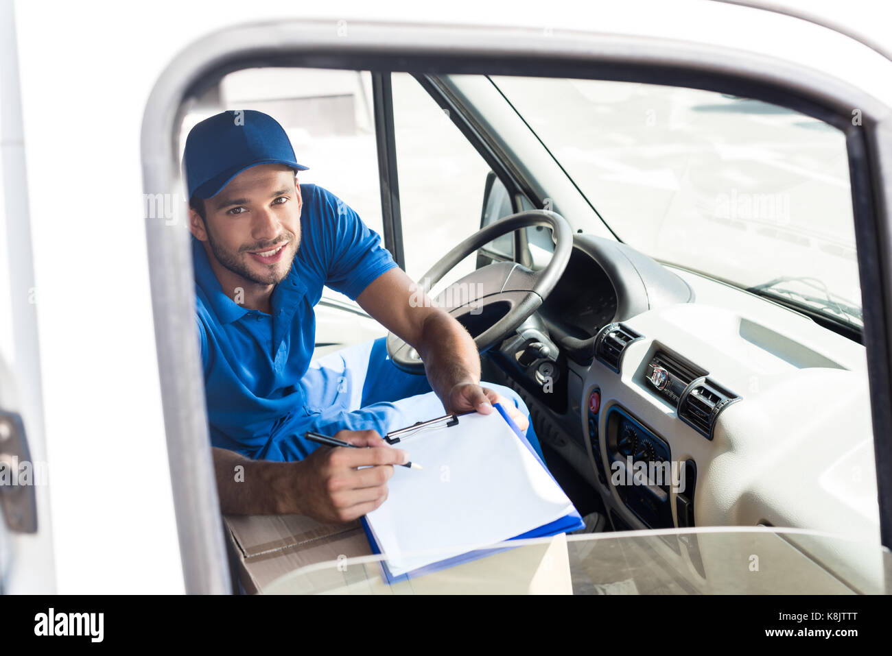 Delivery Man With Clipboard Stock Photo Alamy