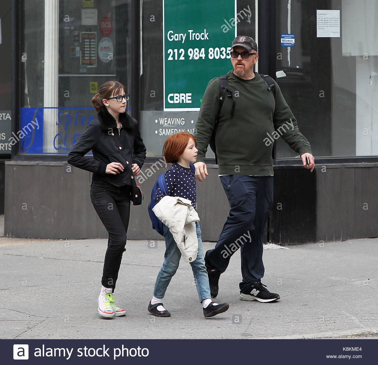 Louis CK, Mary Louise Szekely and Kitty Szekely. Louis CK walks his Stock Photo, Royalty Free ...