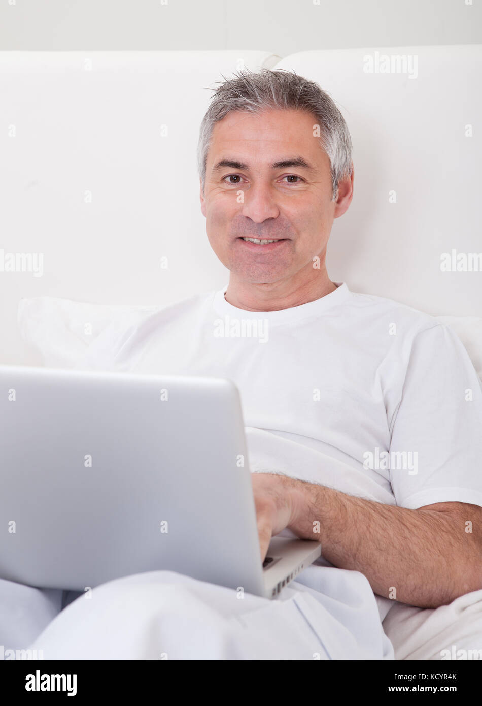 Portrait Of Happy Mature Man With Laptop Stock Photo Alamy