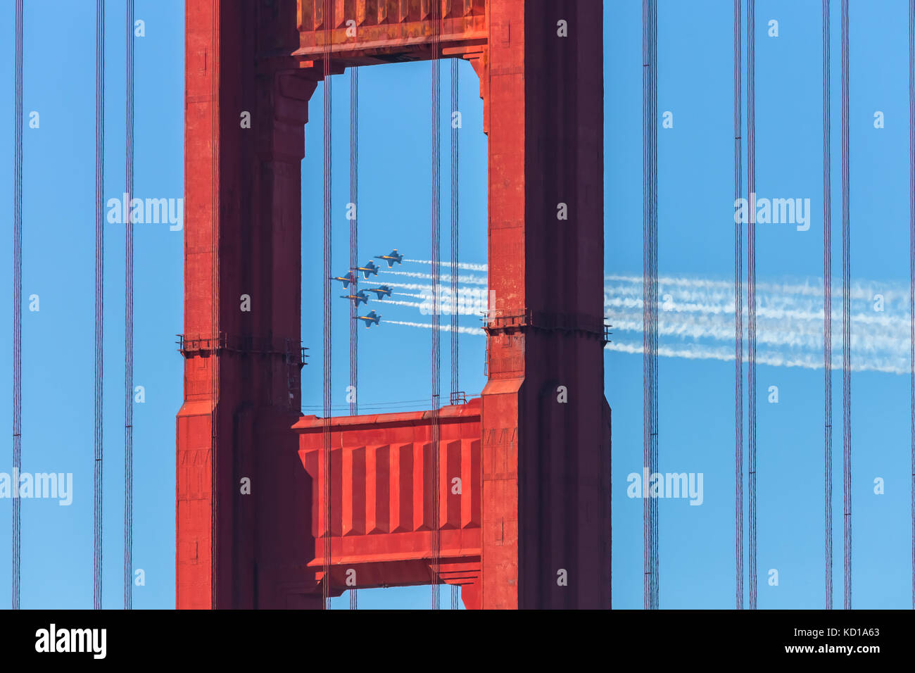 The United States Navy airplanes, The Blue Angles, fly over the Golden Gate Bridge during the airshow performance Stock Photo